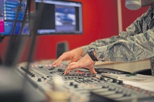 Senior Airman Eli Smith, American Forces Network Kaiserslautern broadcast journalist, DJs a radio morning show Sept. 10 on Vogelweh.