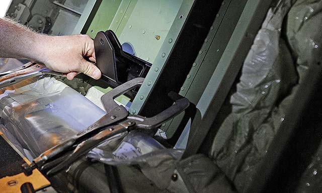 Joel Rykard, 560th Aircraft Maintenance Squadron mechanic from Robbins Air Force Base, Ga., prepares a C-130J Super Hercules to be compatible for a new seat as part of the Time Compliance Technical Order configuration.