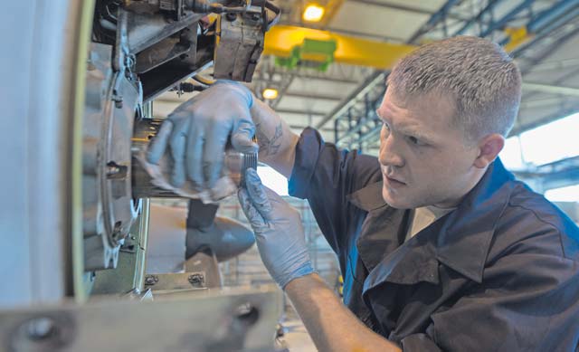 Photo by Airman 1st Class Jordan CastelanSenior Airman Austin Payne, 86th Aircraft Maintenance Squadron aerospace propulsion technician, cleans and applies lubrication during a repair on Ramstein. Payne and other 86th AMXS Airmen replaced a prop shaft adapter on a C-130J Super Hercules. 