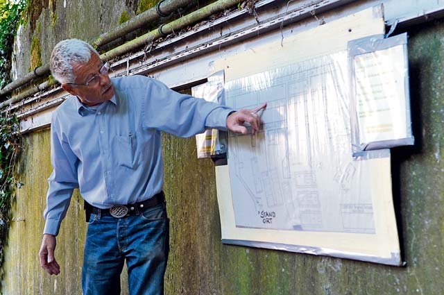 Wolfgang Wuermel, owner of the Kindsbach Cave, details a map of the Air Defense Operations Center bunker Aug. 16 in Kindsbach. The bunker was built prior to World War II and was utilized for command and control operations for the German army. After the war, it was passed to the French, who used it primarily for storing munitions. The U.S. Air Force gained control of the bunker in 1954 and turned it back into a command and control center where air operations could have been led if the Cold War turned hot.