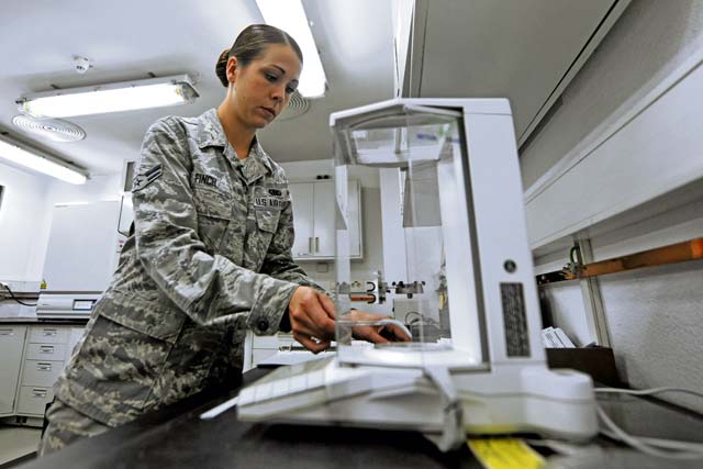 Airman 1st Class Sophia Finch, 86th Logistics Readiness Squadron laboratory technician,  performs a bottle method test on a pipeline receipt Aug. 15 on Ramstein. The bottle method tests for filtration time and contamination in the fuel.