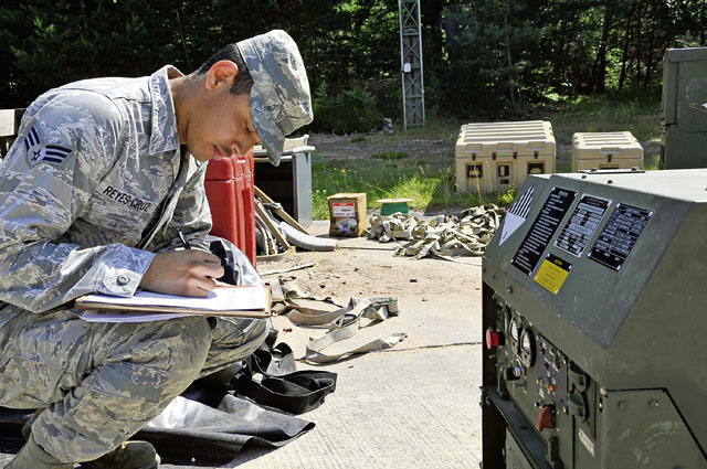 Senior Airman Denis Reyes-Cruz, 1st Combat Communications Squadron electrician, performs a check on a generator during a training exercise July 10 on Ramstein. The exercise was held in order to ensure Airmen can perform the mission outside of a normal training environment.