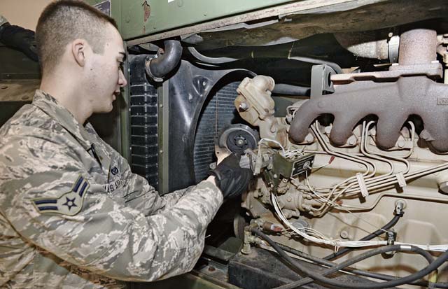 Airman 1st Class Daniel Tomasek, 1st Combat Communications Squadron electrical power  production technician, repairs a generator to provide communications support.