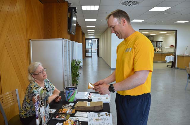 Sandi Magill, prevention coordinator for U.S. Army Garrison Baden-Württemberg and Kaiserslautern Army Substance Abuse programs, talks with Lt. Cmdr. Jason Gabbard during a Brown Bag Lunch Session April 25 at the Sembach Community Center on Sembach Kaserne.