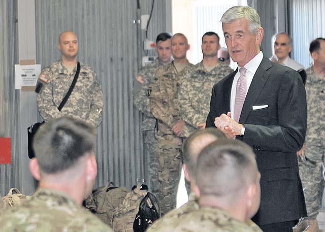 Secretary of the Army John McHugh speaks with transiting service members returning from Afghanistan during a visit to Mihail Kogalniceanu Air Base Sept. 20 in Romania.