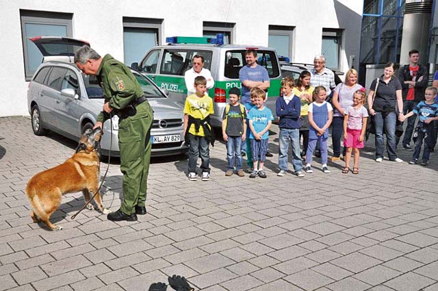 Courtesy photo A police officer demonstrates his work with a police dog during a previous open house at the Westpfalz Police Headquarters in Kaiserslautern.