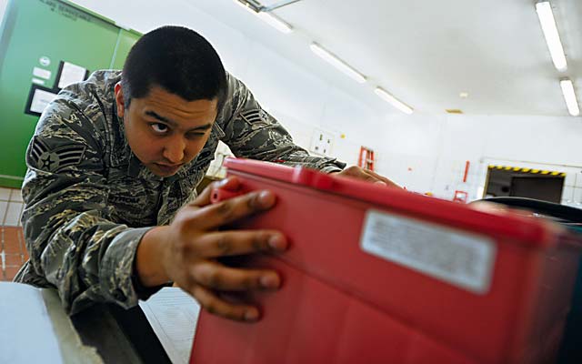 Senior Airman Gabriel Sundstrom, 86th Maintenance Squadron electrical and environmental specialist, checks for damage on a battery Jan. 15 on Ramstein.