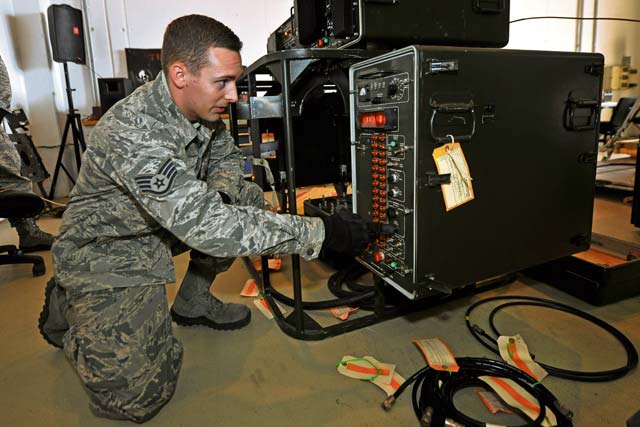Staff Sgt. Dylan Gaudette, 1st Combat Communications Squadron airfield systems technician, adjusts the deployable Air Traffic Control and Landing Systems mobile navigational aid  Nov. 13 on Ramstein. The TACAN system is checked and verified so all the information sent to the aircraft is correct.