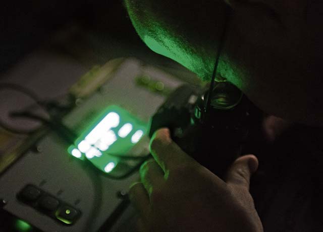 Staff Sgt. Anthony Gentry, 86th Operations Support Squadron aircrew flight equipment, checks a pair of night vision goggles Jan. 14 on Ramstein. 