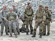 U.S. Army Soldiers Sgt. 1st Class Jason Rizzi (left), civil affairs operations NCOIC, Company A, 457th CA Battalion, 361st CA Brigade, 7th Civil Support Command; Sgt. 1st Class 
Michael Kennicker (center left), first sergeant, Co. A, 457th CA Bn., 361st CA Bde., 7th CSC; and Staff Sgt. David Heath (rear left), civil affairs NCO, Co. A, 457th CA Bn., stand next to British service members as they all receive range instructions during the “Lombardia 2013” international patrolling competition May 25.