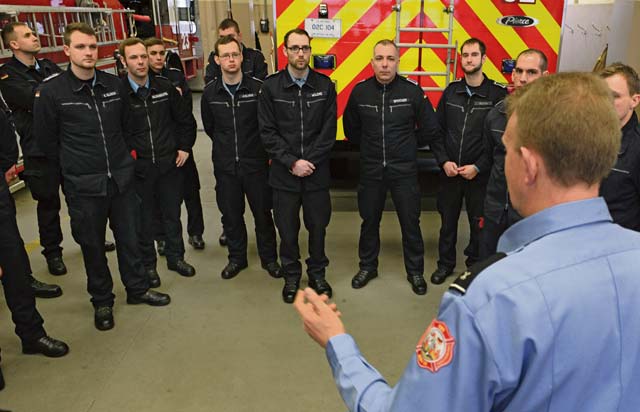 Bundeswehr firefighters receive a briefing on Air Force firefighter training measures during a fire training exercise Feb. 13.