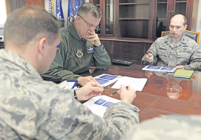 Gen. Frank Gorenc, U.S. Air Forces in Europe and Air Forces Africa commander, listens to Col. Dale Anderson, USAFE-AFAFRICA Innovation and Transformation Office chief, discuss the command’s plan for more than 16,000 Airmen to revalidate their dependents at USAFE-AFAFRICA Headquarters April 10. After the briefing, Gorenc completed the form to revalidate his dependents personally.