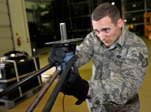 Staff Sgt. Dylan Gaudette, 1st Combat Communications Squadron airfield systems technician, adjusts the monitor antenna.