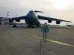 A member of the 721st Aerial Port Squadron conducts a foreign object damage prevention walk on the Ramstein flightline.
