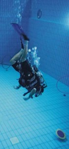 Wounded warriors practice scuba diving by swimming through hoops and playing underwater hockey.