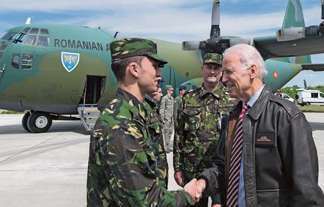 U.S. Vice President Joe Biden shakes hands with a Romanian service member May 20 in Bucharest, Romania. During his visit Biden met with U.S. and Romanian service members and spoke about the importance of their continued partnership.
