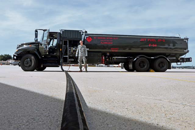 Senior Airman Michael Walters, 86th Logistics Readiness Squadron fuels mobile distribution operator, monitors fueling of a C-130 Hercules.