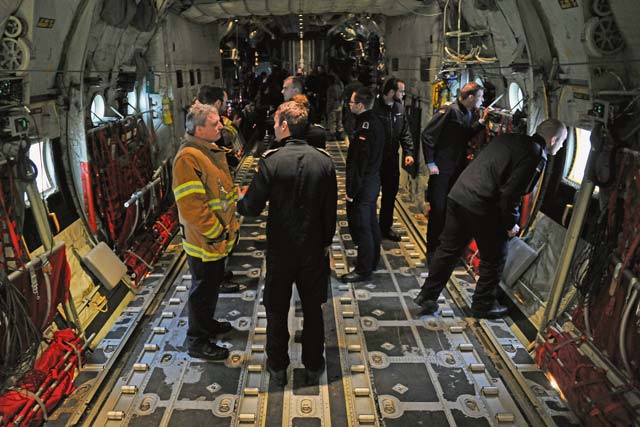 Bundeswehr firefighters check out a C-130J Super Hercules to be able to support Ramstein in  case of emergencies.