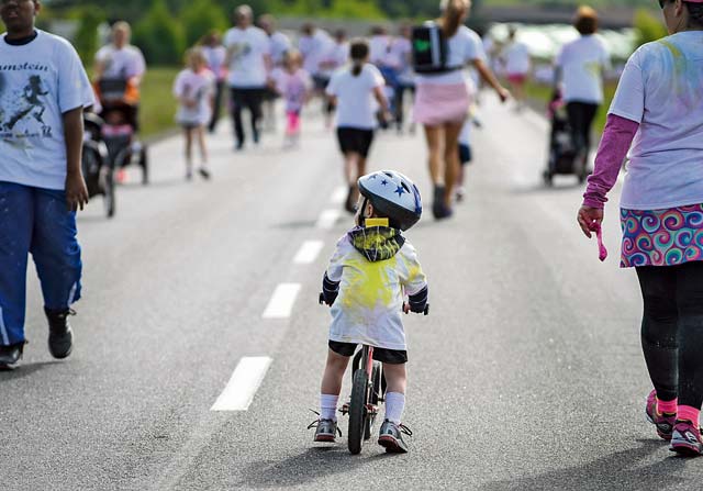 Photo by Staff Sgt. Sara KellerA child rides his bike during the Keystone Color Run May 10, 2014, on Ramstein.