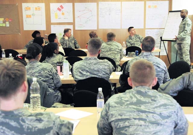 More than 50 students of the Air Force Smart Operations for the 21st Century Green Belt Process Improvement Class listen to a student presentation inside the 435th Construction Training Squadron Auditorium April 4 on Ramstein. The class focused on improving work center processes while removing waste or non-value added activities.