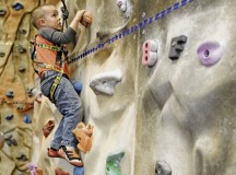 Photo by Airman 1st Class Holly MansfieldIsaac Siembida, son of Master Sgt. Jeremiah Siembida, U.S. Air Forces in Europe and Air Forces Africa command programs manager, climbs the rock wall at the Outdoor Recreation Center during an Exceptional Family Member Program event in May on Ramstein. EFMP offers medical and force support to military families with special needs.