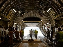 Photo by Staff Sgt. Ryan CraneAirmen from the 435th Air Ground Operations Wing, 62nd Airlift Wing and 571st Contingency Response Group load vehicles, equipment and Rwandan soldiers onto a C-17 Globemaster III Jan. 19 in Rwanda, Africa. U.S. forces will transport a total of 850 Rwandan soldiers and more than 1,000 tons of equipment into the Central African Republic to aid French and African Union operations against militants during this three-week operation.