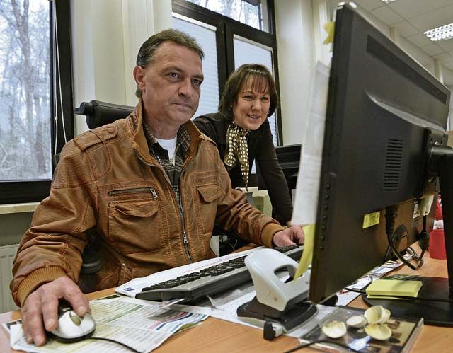 Andreas Schmal (left), 86th Civil Engineer Squadron housing inspector, and Diana Keener, 86th CES facilities chief of housing, work together to help service members gather housing information April 3 on Vogelweh.