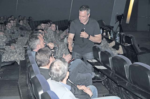 Photo by Dijon Rolle Stand-up comedian Bernie McGrenahan entertains Airmen, Soldiers and civilians during his “Happy Hour" comedy show April 14 at the Hercules Theater and April 15 at Vogelweh’s Galaxy Theater. McGrenahan tours military installations around the world sharing his own personal struggles with alcohol dependency to encourage service members and their families to drink responsibly.