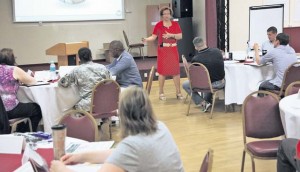 Shelia Brigham Jones, training specialist assigned to Army Reserve Family Programs and employed by Choctaw Contracting Services and a resident of Nashville, Tenn., teaches a class on family readiness group outreach and communication Aug. 2 in the Kaiserslautern Community Activities Center during an ARFP-led FRG conference and training event. 