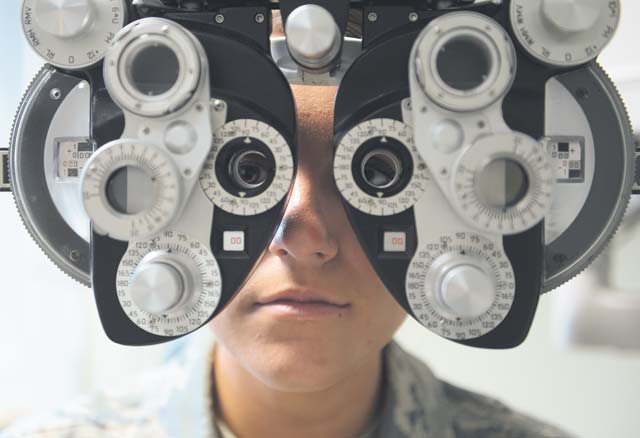 Photos by Senior Airman Michael StuartSenior Airman Danielle Marsh, 86th Aerospace Medical Squadron public health technician, looks through an optical refractor during an optometry demonstration. Doctors at the clinic see an average of 50 patients a day. As U.S. Air Forces in Europe and Air Forces Africa’s largest optometry clinic, they treat anyone from 5 years and older for anything from retraining physicals to school screenings. 