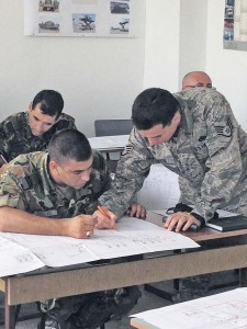 Courtesy photoStaff Sgt. Luis Devotto, 435th Air Ground Operations Wing’s Contingency Readiness Group Air Adviser Branch air adviser special vehicle maintenance, goes over a schematic of a Halvorsen Loader aircraft loader with a Bulgarian Joint Forces Command members in Plovdiv, Bulgaria. Devotto and Staff Sgt. Jonathan Rasmussen, 48th Logistics Readiness Squadron transportation specialist from Royal Air Force Lakenheath, England, trained 16 members for two Bulgarian movement control teams on the operations and maintenance of a Halvorsen Loader.