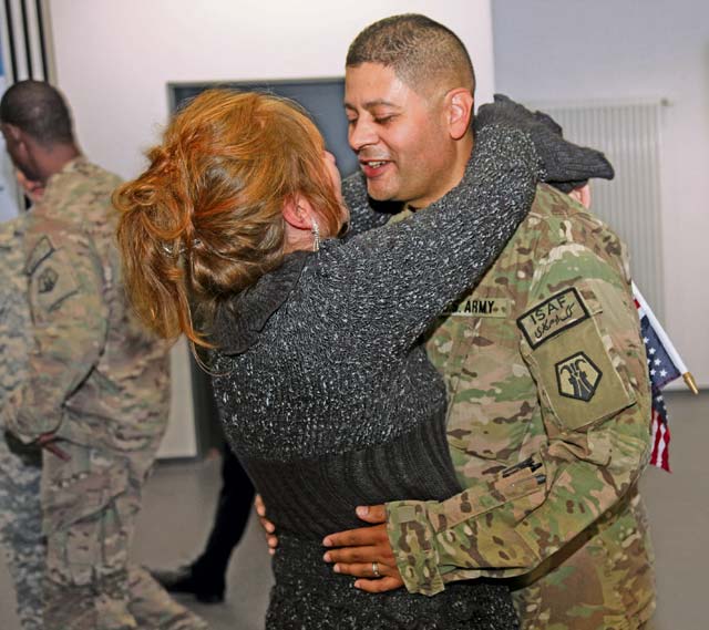 Army Reserve Staff Sgt. Johnny Sarabia, a member of the 209th Digital Liaison Detachment (Forward), hugs his wife, Claudia, for the first time in over four months Oct. 7 during a redeployment ceremony for 28 Army Reserve Soldiers from the 7th Civil Support Command’s 209th DLD (FWD) and the 406th Human Resources Company, as they arrived from missions supporting Operation Enduring Freedom in Afghanistan, Kuwait and other Middle Eastern countries.