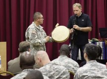Photo by Sgt. 1st Class Matthew ChlostaStaff Sgt. Carlos Guardardo, Panzer Kaserne installation coordinator from the 21st Special Troops Battalion, 21st Theater Sustainment Command, plays a hand drum in accompaniment with 
Kevin Morris, an education technologist at Kaiserslautern Middle School, who plays a musical piece on a Native American style flute during the Native American Heritage Month celebration event Nov. 21 at the Kaiserslautern Community Activities Center.