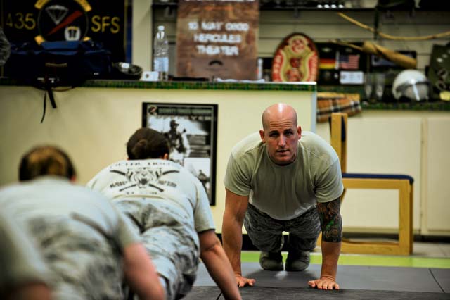 Staff Sgt. Mark M. Karas, 435th Security Forces Squadron F.A.S.T. instructor, leads a physical-training session. Many instructors for F.A.S.T. have completed the Phoenix Raven program, which specializes in aircraft security under hostile conditions.