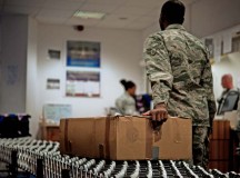 Senior Airman Jonathan Lee, 86th Communications Squadron finance clerk, moves a package to the delivery area Oct. 24 at the Ramstein Northside Post Office. As the holidays approach, Airmen working at the post office will work longer hours to ensure operations continue to run smoothly.