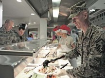 Master Sgt. Jay Peavley, 435th Construction and Training Squadron first sergeant, helps serve food to Airmen and their families at the Rheinland Inn Dining Facility.