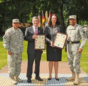 Photo by Spc. Iesha HowardMayor of Kaiserslautern Dr. Susanne Wimmer-Leonhardt and Kaiserslautern County Commissioner Paul Junker pose with  Maj. Gen. Aundre F. Piggee, the commanding general of the 21st Theater Sustainment Command, and Command Sgt.  Maj. Michael A. Sanchez, the command sergeant major of the 21st TSC, during an Honorary Colonel Induction ceremony  June 5 on Panzer Kaserne. The honorary colonels are local nationals who contribute to the relationship between the command and the local official and business communities in Kaiserslautern.