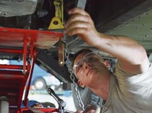 Airman 1st Class Brock Taczak, 86th Vehicle Readiness Squadron light vehicle mechanic, 
attaches a jack to a Humvee before removing the transmission.