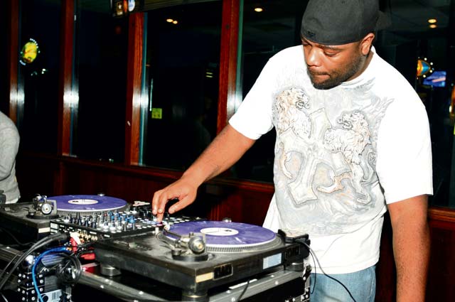 Staff Sgt. Christopher Hunt, video teleconference specialist with the 21st Theater Sustainment Command, works the turntables in the Battle of the DJs competition Jan. 9 at Armstrong’s Club.