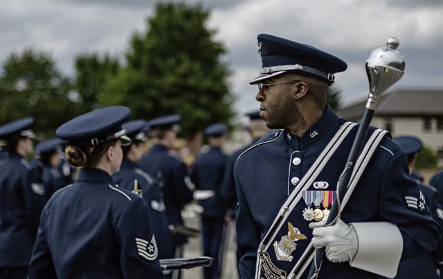 Senior Airman Christopher Jackson, U.S. Air Forces in Europe and Air Forces Africa Band drum major, inspects the band prior to the sounding of retreat June 27 on Ramstein. The USAFE-AFAFRICA Band and the 86th Aircraft Maintenance Squadron both took part in retiring the American and German national flags for the day.