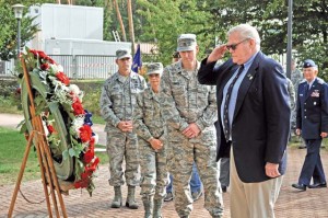 Photo by Senior Airman Aaron-Forrest WainwrightPatrons pay tribute to the fallen during the wreath-laying ceremony as a part of POW/MIA week Sept. 21 on Ramstein. The wreath-laying ceremony was held in memory of prisoners of war and those missing in action.
