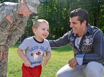 During a recent reunion at U.S. Army Garrison Kaiserslautern, German soldier Liridon Lukaj (right) meets with Spc. Heather Colton and her son, Riley. In April 2012, Lukaj helped rescue them from a severe traffic accident on autobahn A6 near Einsiedlerhof.