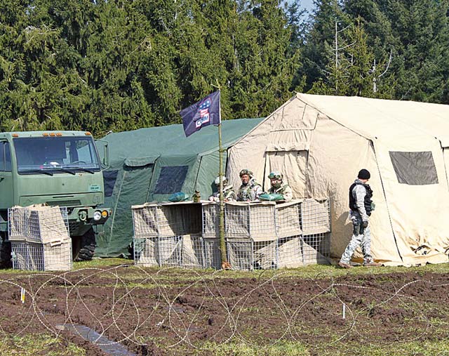 Courtesy photo Airmen from the 1st Combat Communications Squadron guard an entry control point May 24 on Ramstein. The 1st CBCS recently conducted phase two of a series of exercises, that will test Airmen’s proficiencies and ensures they are  prepared for real-world missions.