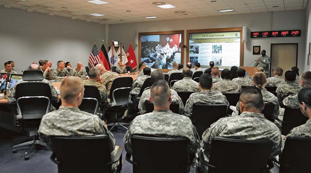 Commander’s conference Sgt. 1st Class Johnnie Ebron, the senior noncommissioned officer and the project lead for the Fit 2 Lead Initiative with the 5th Signal Command, explains the Fit 2 Lead Initiative during the Commander’s Conference on Panzer Kaserne, May 21. The Fit 2 Lead Initiative is a technique using physical fitness as the vehicle to develop individuals and teams. Maj. Gen. Aundre F. Piggee, the commanding general of the 21st Theater Sustainment Command, provided command teams/leaders with critical information and guidance to shape the future of the command. Additional conference topics included the state of the 21st TSC, profession of arms: Army customs, courtesies and traditions, the new Army evaluations programs, suicide prevention program implementation, comprehensive Soldier and family fitness resilience training and campaign program.