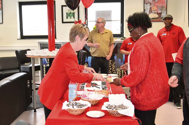 Mary Jane Spreier (left) and Emma Robinson serve cake during the grand opening of the Baumholder Warrior Zone on Smith Barracks in Baumholder. The new Warrior Zone is located in Bldg. 8106 next to the Hall of Champions.