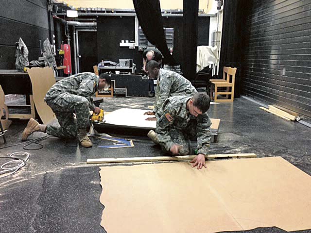 U.S. Army photo Spc. Brandon Barrett, Pvt. Diallo Young and Sgt. Allen Clapper make stage props for Vilseck High School’s production of “The  Little Mermaid.” The Soldiers are assigned to the 902nd Vertical Construction Company, 15th Engineer Battalion, of the 21st Theater Sustainment Command’s 18th Engineer Brigade.
