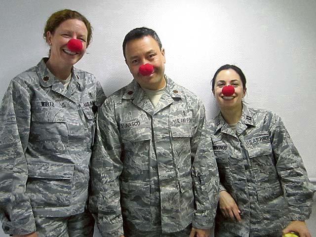 Courtesy photo Family Advocacy Officer Maj. Ellen Wirtz, Mental Health Flight Chief Maj. Travis Lunasco and Capt. Alison Valdovinos from the Ramstein Mental Health Clinic show their support for the Red Nose Institute.