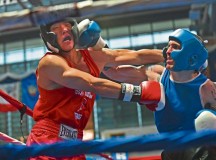 Marine 1st Lt. Daniel Kim, boxer, receives a left jab to the face May 11 in Wiesbaden. U.S. Army Garrison Wiesbaden hosted the 2013 Installation Management Command-U.S. Forces Boxing Championship.