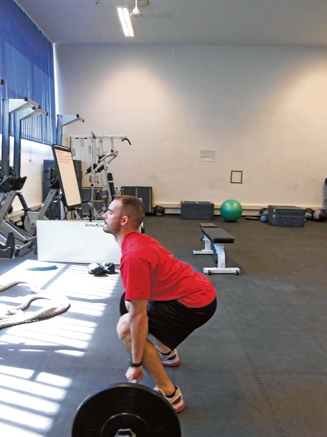 Michael Bates, an exercise physiologist at the Ramstein Health and Wellness Center, correctly demonstrates proper body alignment and back posture during the dead lift. 