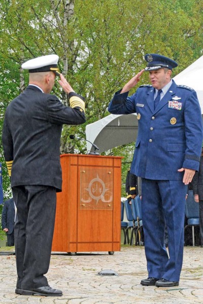 Air Force Gen. Philip M. Breedlove (right) salutes Navy Adm. James G. Stavridis, signifying the change of command May 10 at U.S. European Command Headquarters at Patch Barracks.
